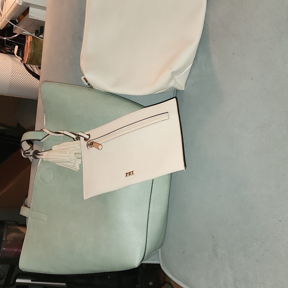 Large tote with tassel detail and interior bags.